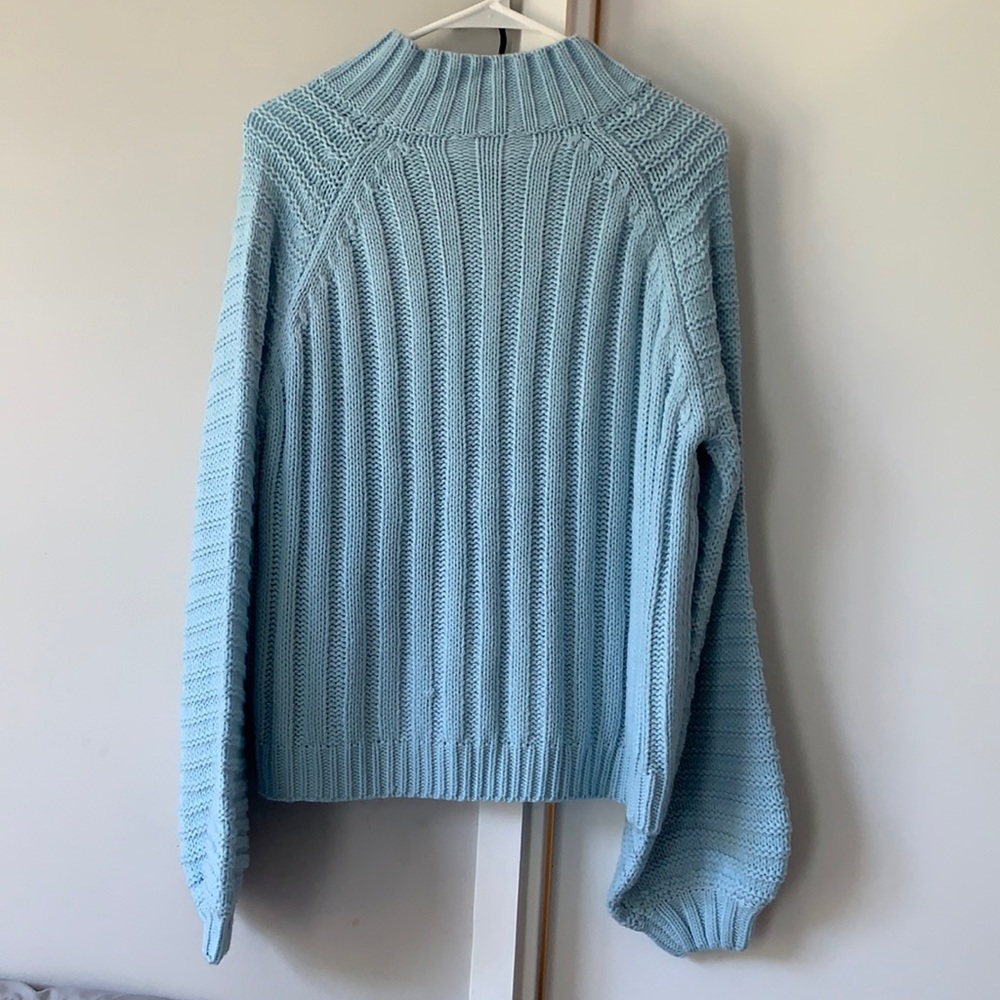 Knitted light blue sweater
